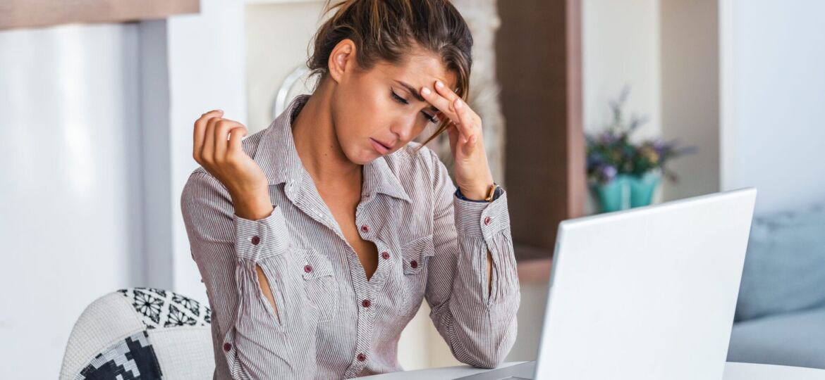 Tired-Frustrated-woman_in_gray_dress_shirt_sitting_on_chair-scopio-2b6d7bf3-6723-42aa-baba-683768d81fa6-scaled